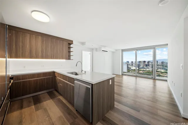 a kitchen with a sink and large window