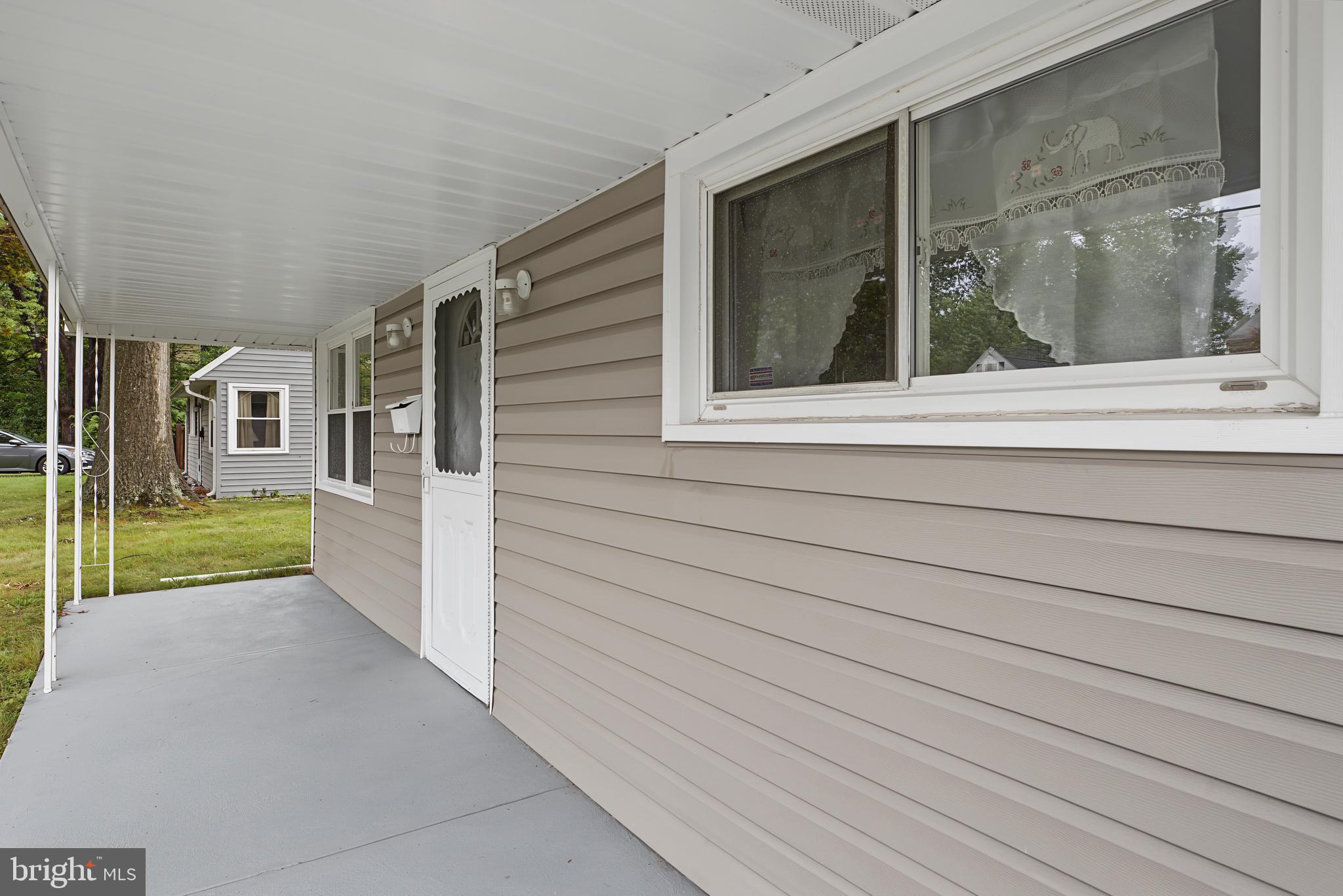 113 Rutledge Avenue Ewing, NJ 08618 - Photo 4 of 27 a view of a house with a porch