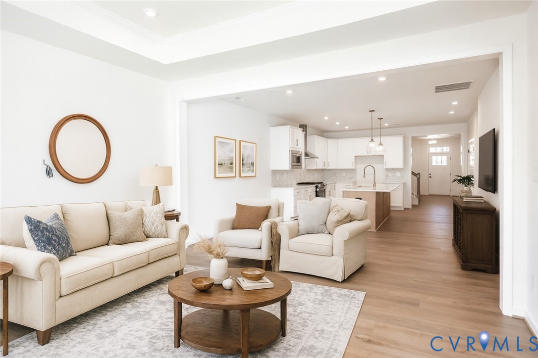 a living room with furniture and a large window