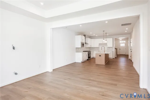 a view of kitchen with wooden floor