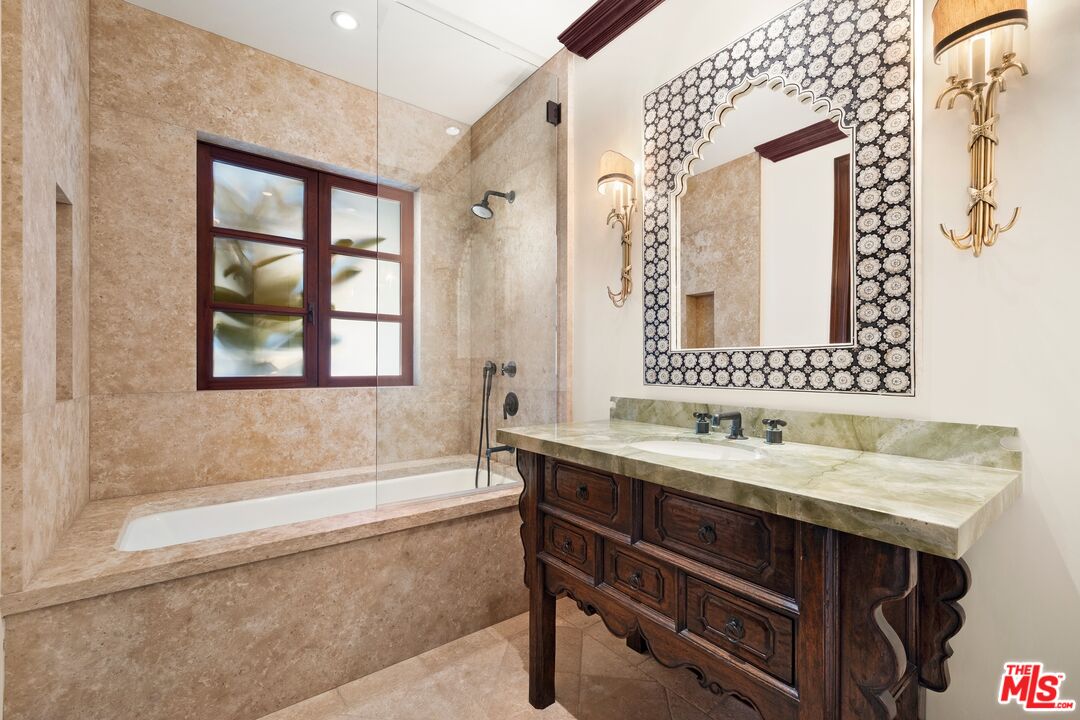 24834 Pacific Coast Highway Malibu, CA 90265 - Photo 28 of 50 a bathroom with a sink and a bathtub
