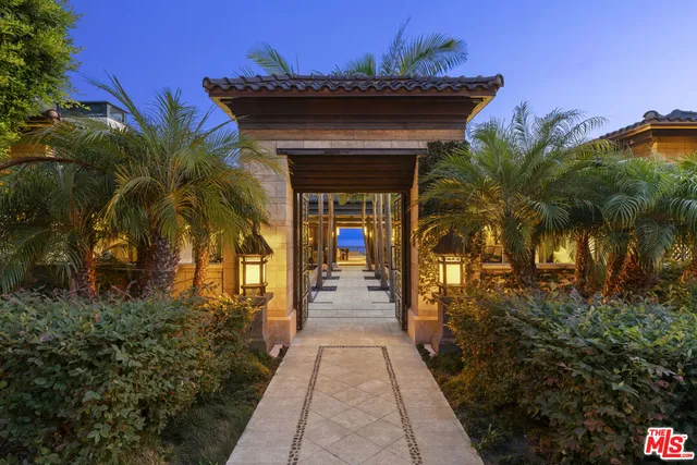 a view of a swimming pool with a garden and plants