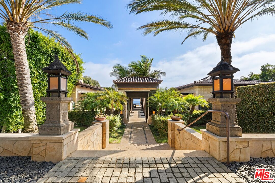 24834 Pacific Coast Highway Malibu, CA 90265 - Photo 6 of 50 a front view of a house with garden