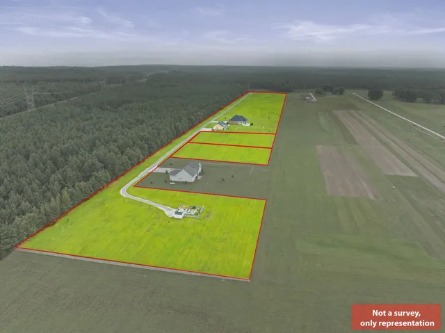 a aerial view of a house with a big yard