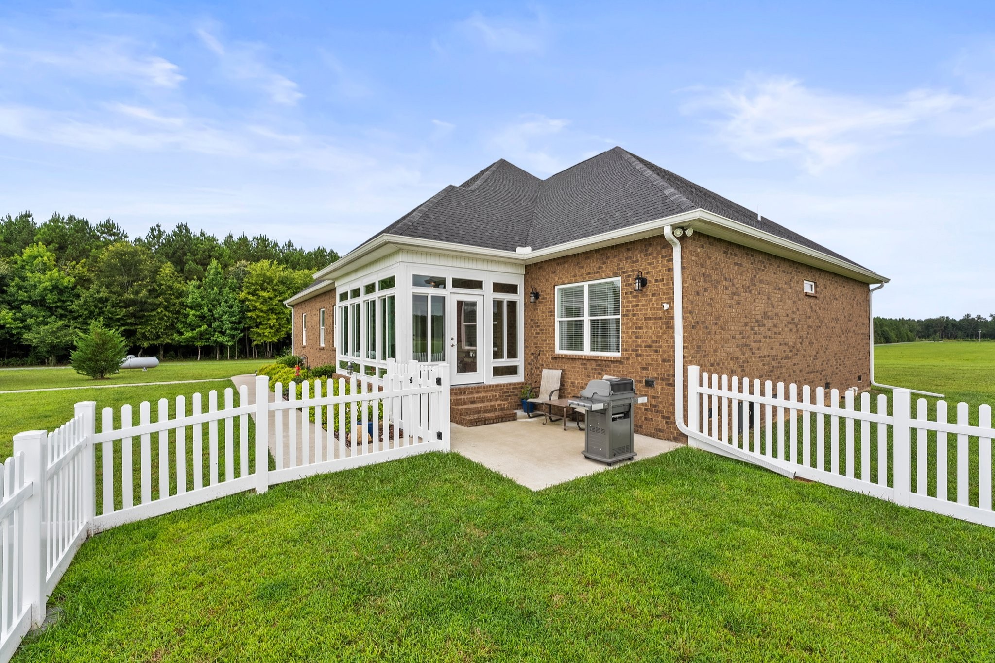 285 Hancock Lane Tullahoma, TN 37388 - Photo 40 of 79 a view of a house with a small yard and a garden