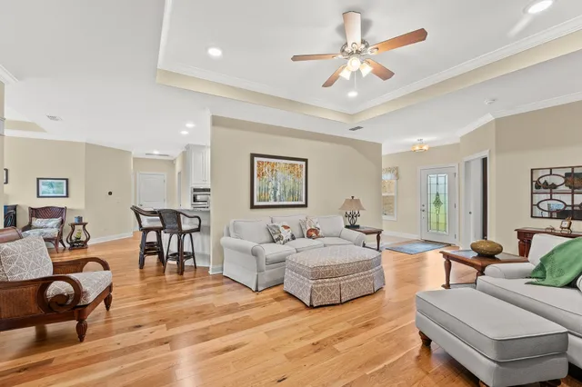 a view of a dining room with furniture and a chandelier