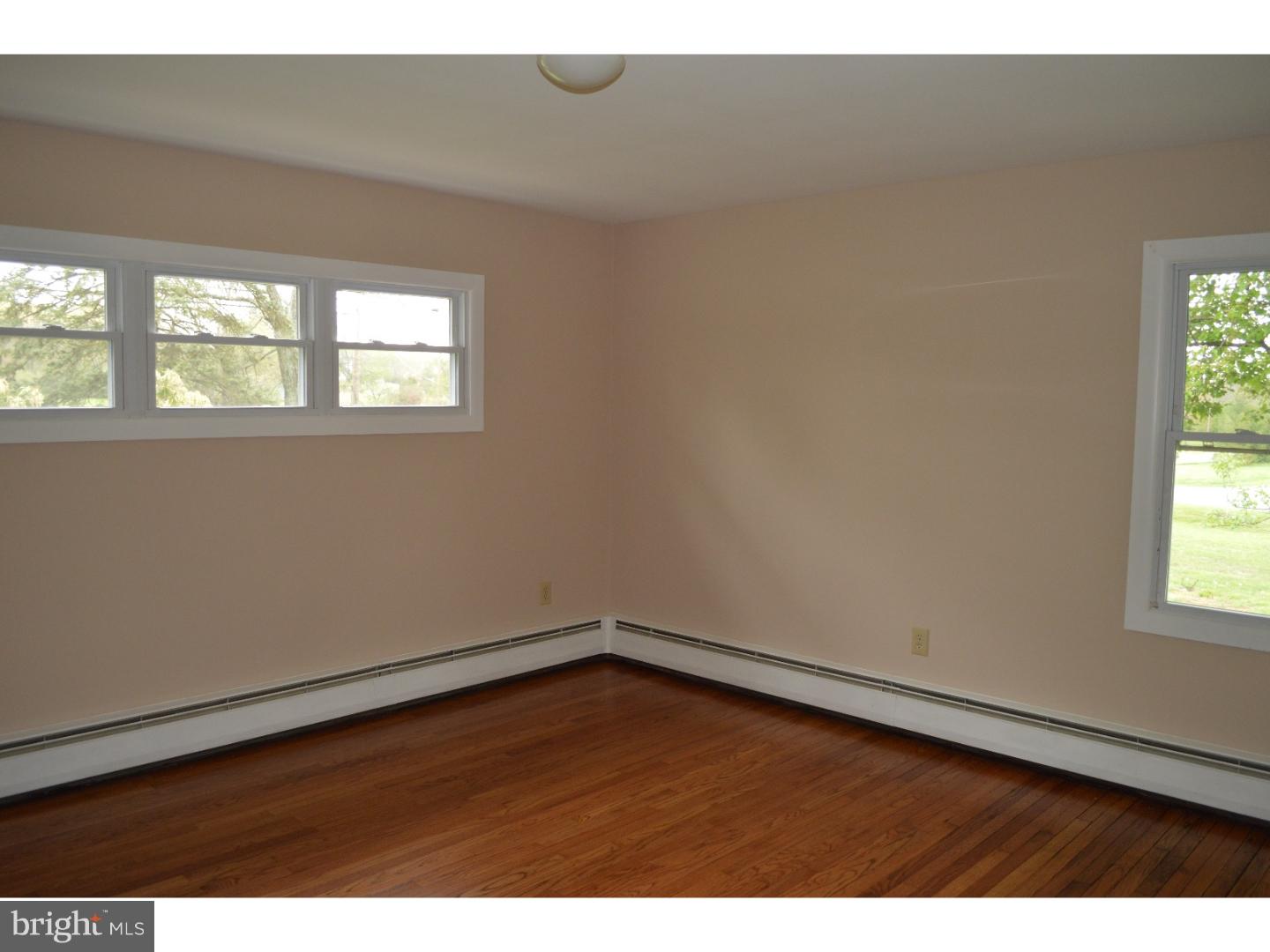1112 Callowhill Road Perkasie, PA 18944 - Photo 12 of 17 an empty room with wooden floor and windows