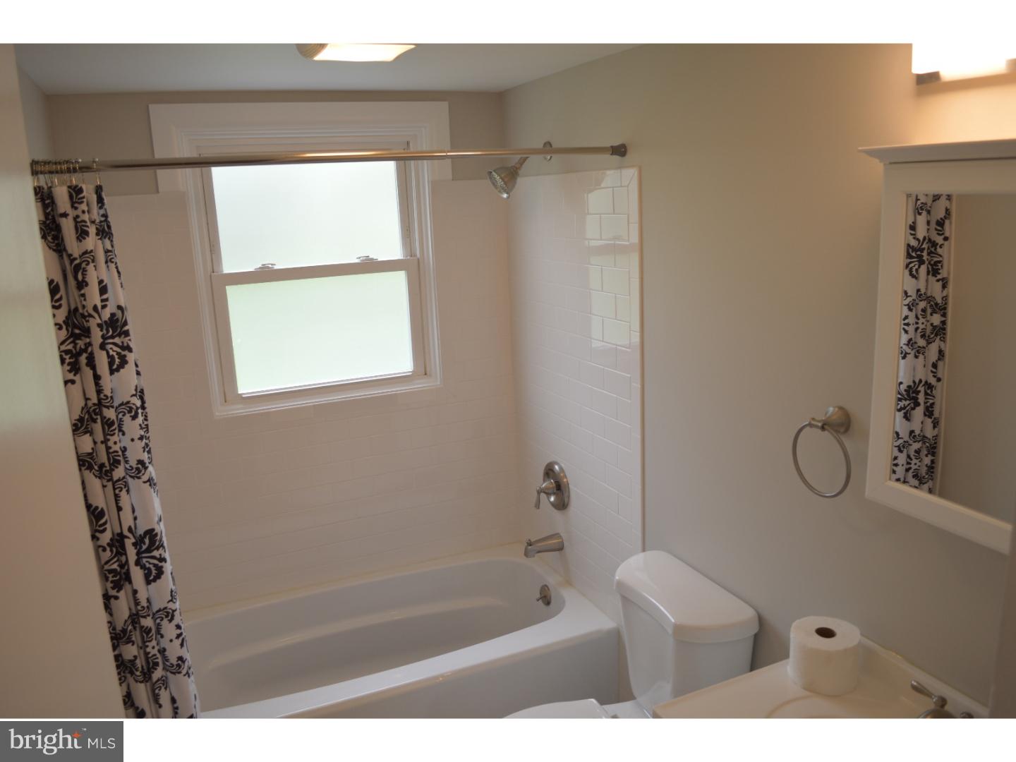 1112 Callowhill Road Perkasie, PA 18944 - Photo 13 of 17 a bathroom with a bath tub and a shower