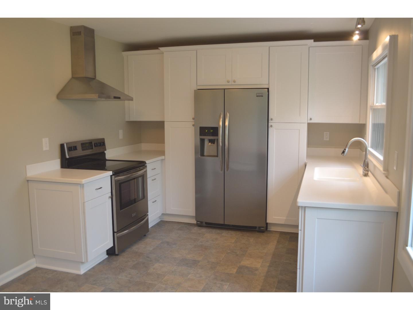 1112 Callowhill Road Perkasie, PA 18944 - Photo 8 of 17 a kitchen with a sink a refrigerator and a stove