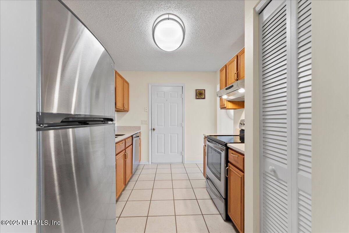 210 Dartmouth Road St. Augustine, FL 32086 - Photo 13 of 27 a walk in closet with wooden floor