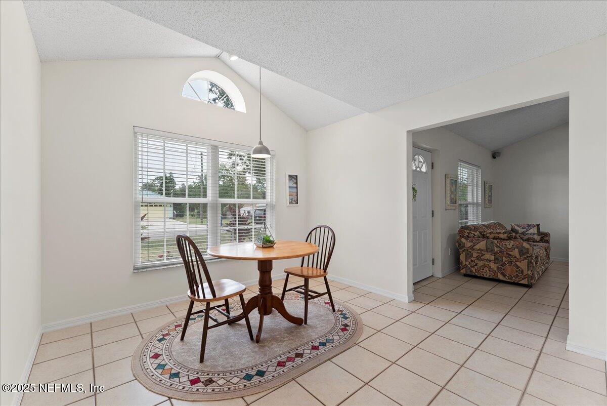 210 Dartmouth Road St. Augustine, FL 32086 - Photo 14 of 27 a dining room with furniture and window