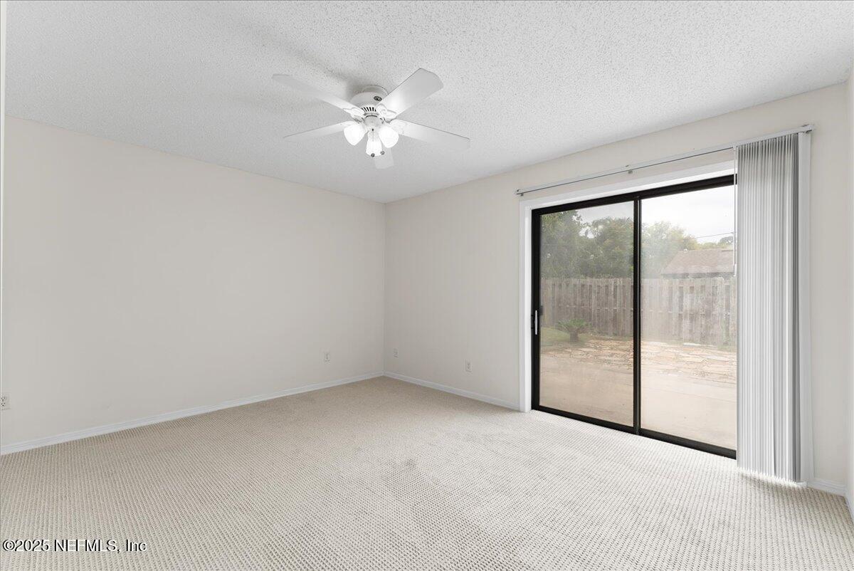 210 Dartmouth Road St. Augustine, FL 32086 - Photo 18 of 27 a view of an empty room with a window