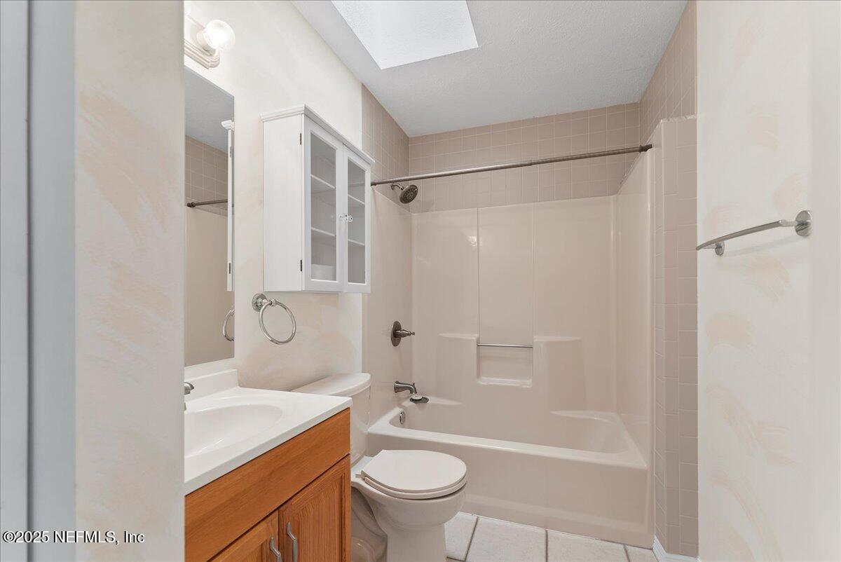 210 Dartmouth Road St. Augustine, FL 32086 - Photo 21 of 27 a bathroom with a granite countertop sink toilet and shower