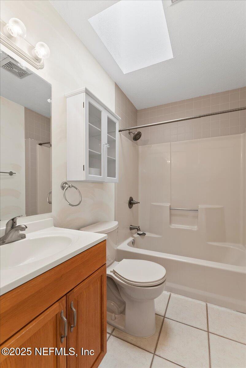 210 Dartmouth Road St. Augustine, FL 32086 - Photo 22 of 27 a bathroom with a sink a toilet and shower