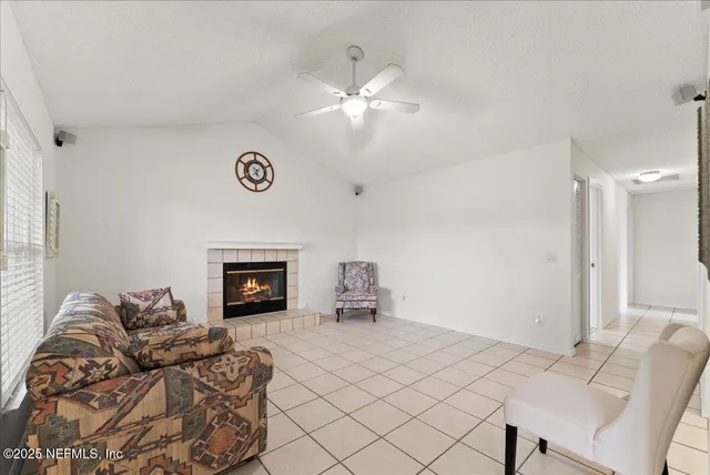 a bedroom with furniture and a fireplace