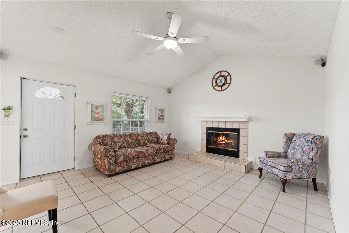 210 Dartmouth Road St. Augustine, FL 32086 - Photo 10 of 27 a living room with furniture and a fireplace