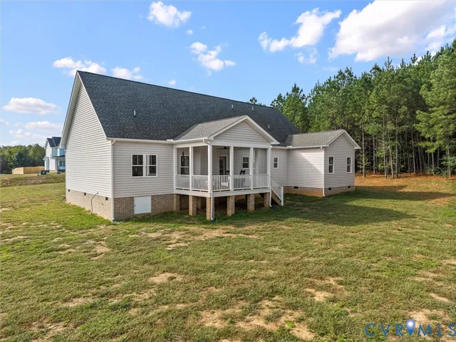a view of a swimming pool with a yard