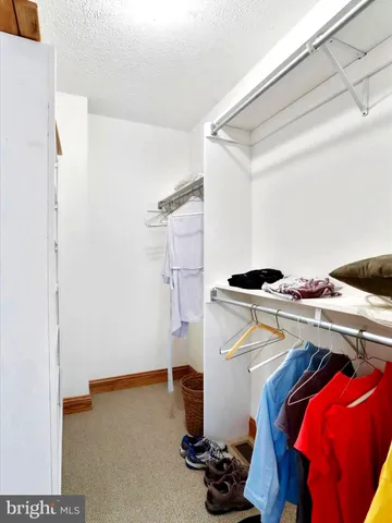 a reading room with furniture and a window