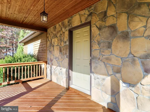 a view of balcony with wooden floor