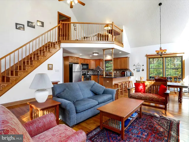 a bed room with furniture and a chandelier