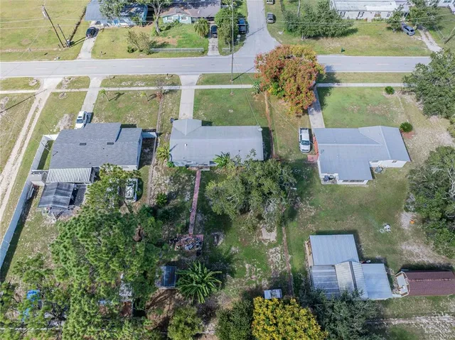 an aerial view of a house with a garden