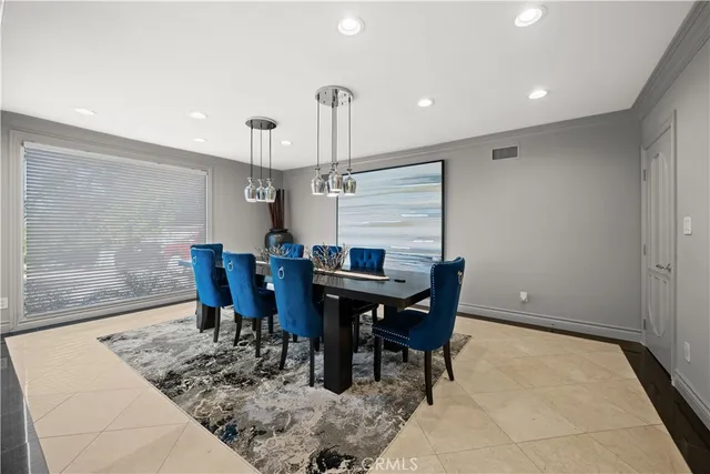 a kitchen with stainless steel appliances kitchen island granite countertop a stove and a sink