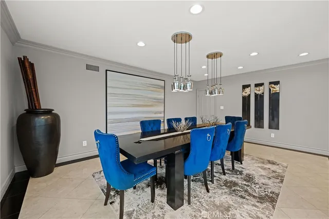 a kitchen with kitchen island granite countertop a stove sink microwave and refrigerator