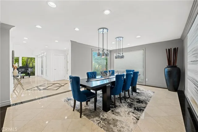 a dining room with furniture and wooden floor