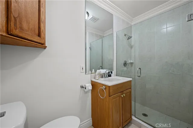 a bedroom with a bed and a flat tv screen