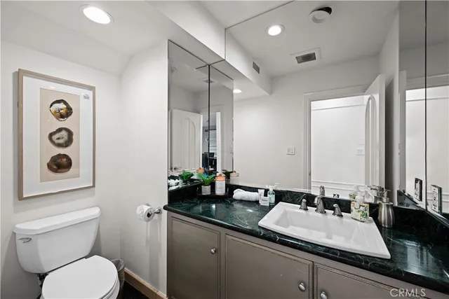 a bedroom with a bed and a table