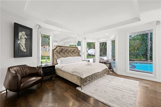 a bathroom with a granite countertop sink a toilet a mirror and shower