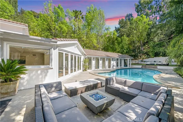 a view of backyard with palm trees