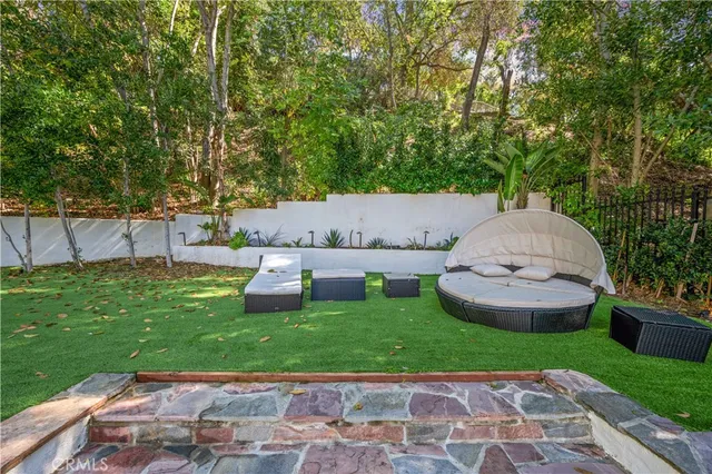 a view of swimming pool with chairs