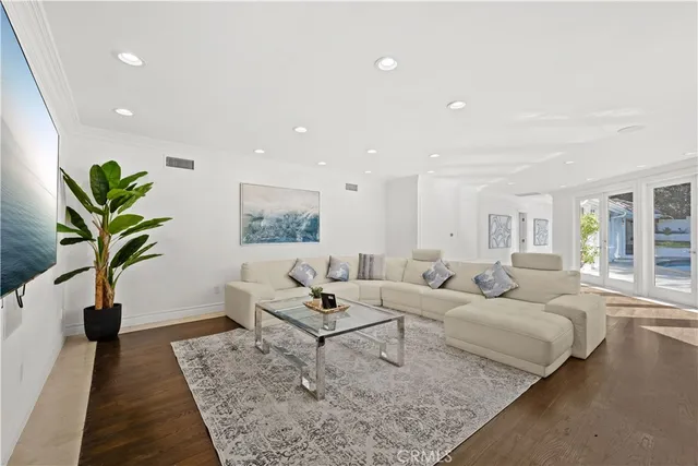 a living room with furniture and a table