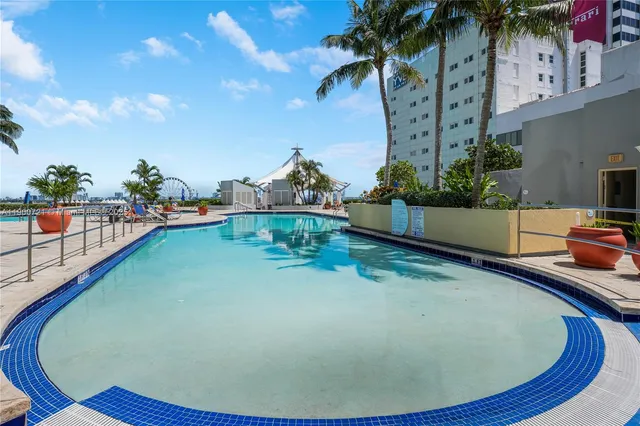 a view of a swimming pool with an outdoor seating