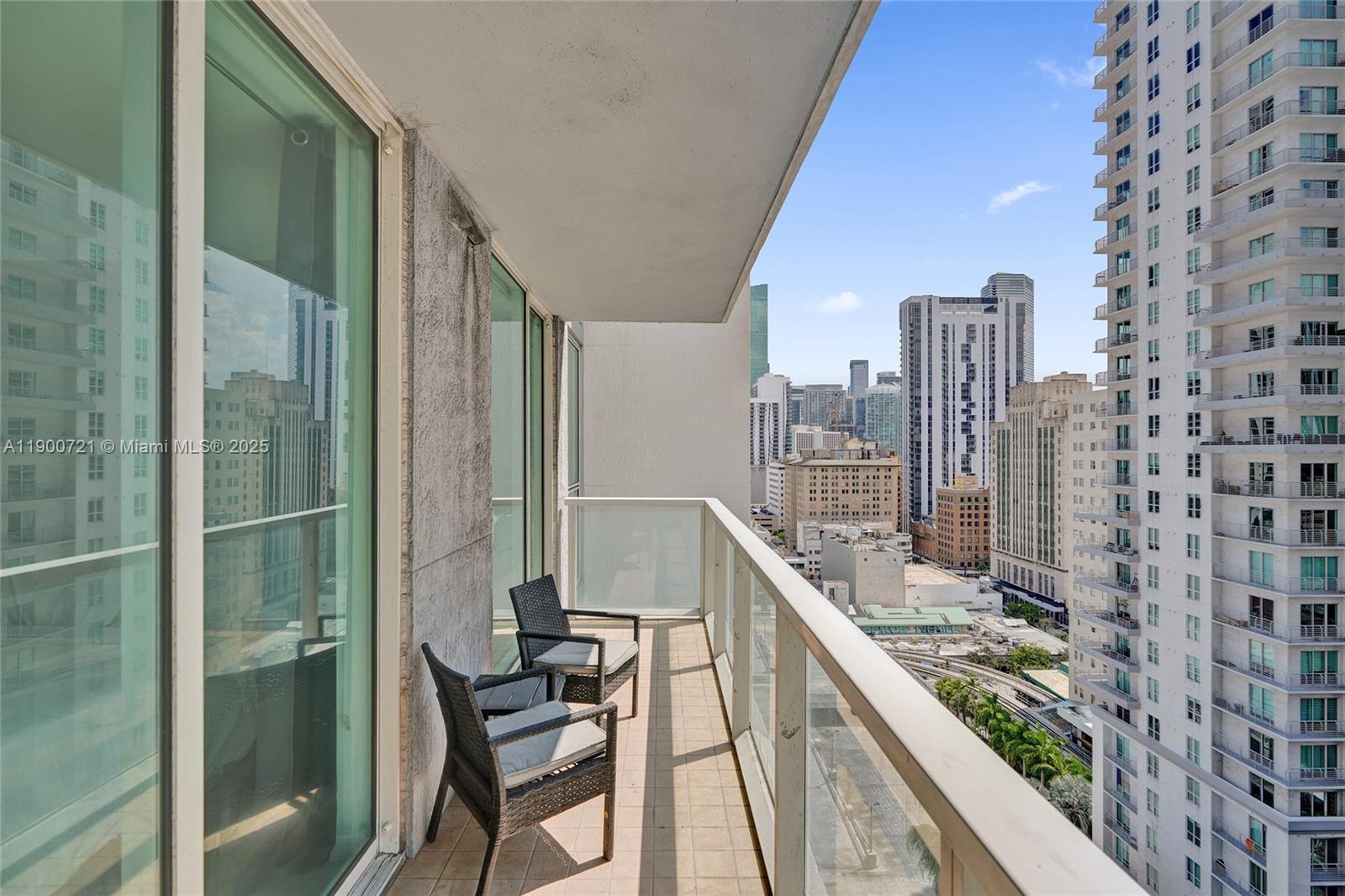 253 Northeast 2nd Street, Unit 1706 Miami, FL 33132 - Photo 24 of 32 a balcony with a water view and city view