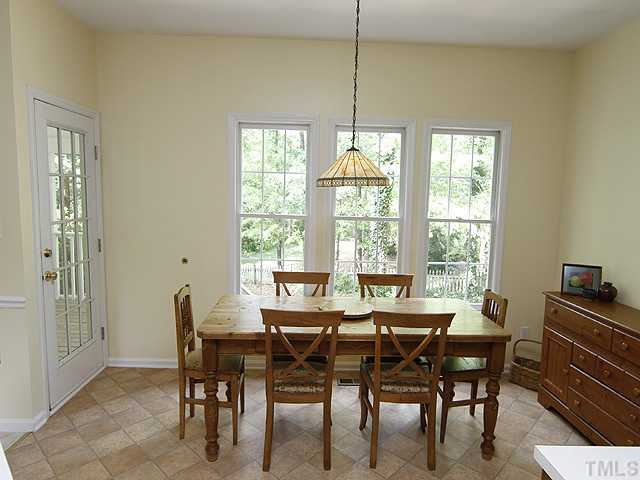 5404 Stewartby Drive Raleigh, NC 27613 - Photo 5 of 12 Extra Large Breakfast Room off Kitchen and Family Room has new flooring, fresh paint, and a gorgeous view of the expansive back yard. Easy access to screened porch!
