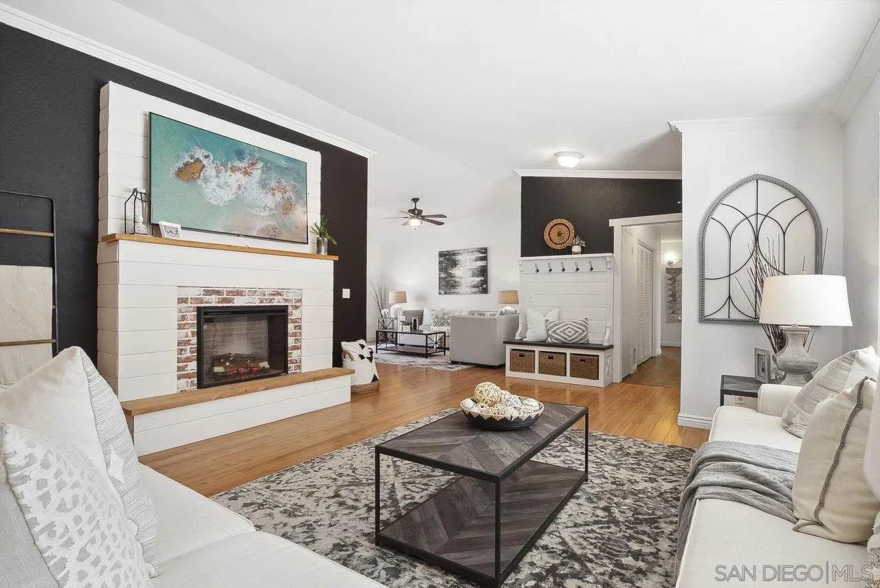 1369 Friends Way Fallbrook, CA 92028 - Photo 3 of 29 a living room with furniture a rug and a fireplace