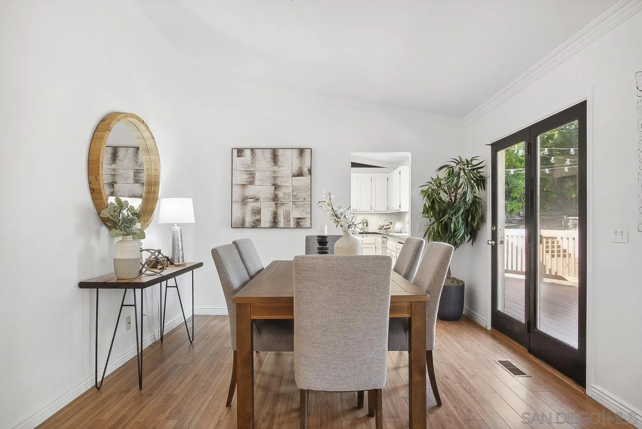 1369 Friends Way Fallbrook, CA 92028 - Photo 10 of 29 a view of a dining room with furniture window and wooden floor