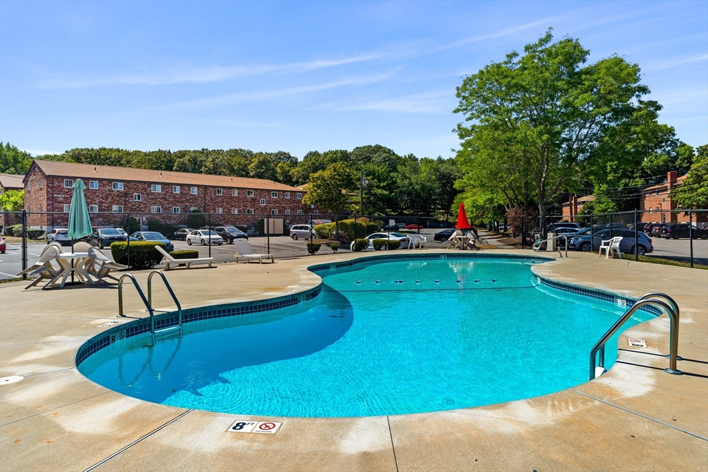 24 Westgate Road, Unit 2 Boston, MA 02467 - Photo 16 of 21 a view of a swimming pool with outdoor seating and plants