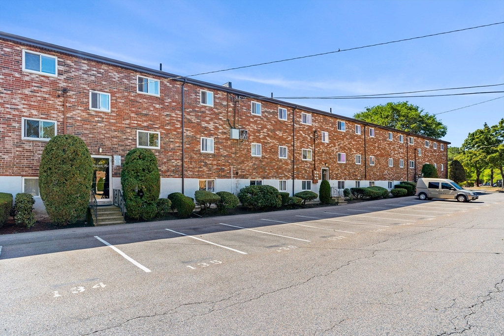 24 Westgate Road, Unit 2 Boston, MA 02467 - Photo 21 of 21 a front view of a building with a garden
