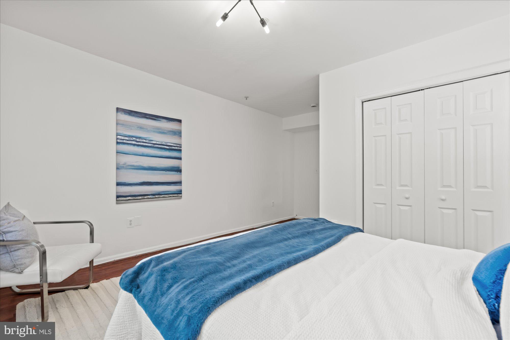 1241 18th Street Northeast, Unit 3 Washington, DC 20002 - Photo 12 of 20 a bedroom with a bed and a window