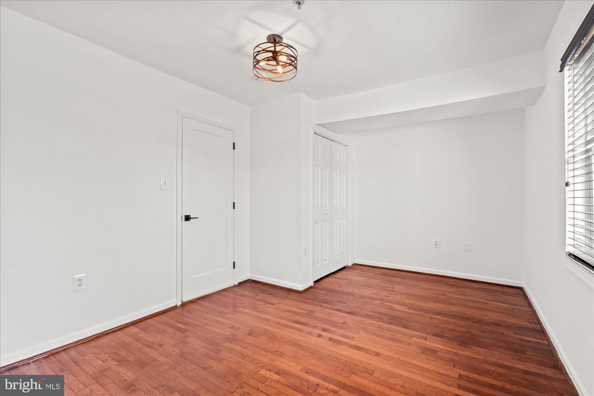 1241 18th Street Northeast, Unit 3 Washington, DC 20002 - Photo 15 of 20 a view of empty room with wooden floor