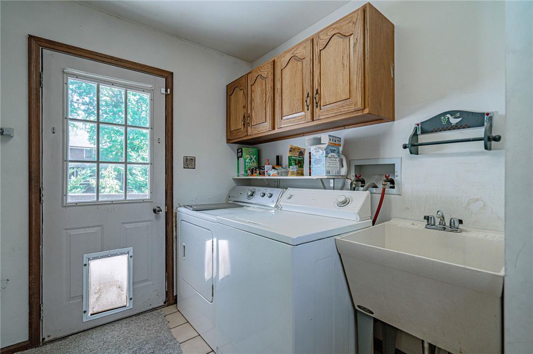 652 Old State Road Oley, PA 19547 - Photo 20 of 54 Functional utility room with ample storage cabinetry and a convenient laundry sink.