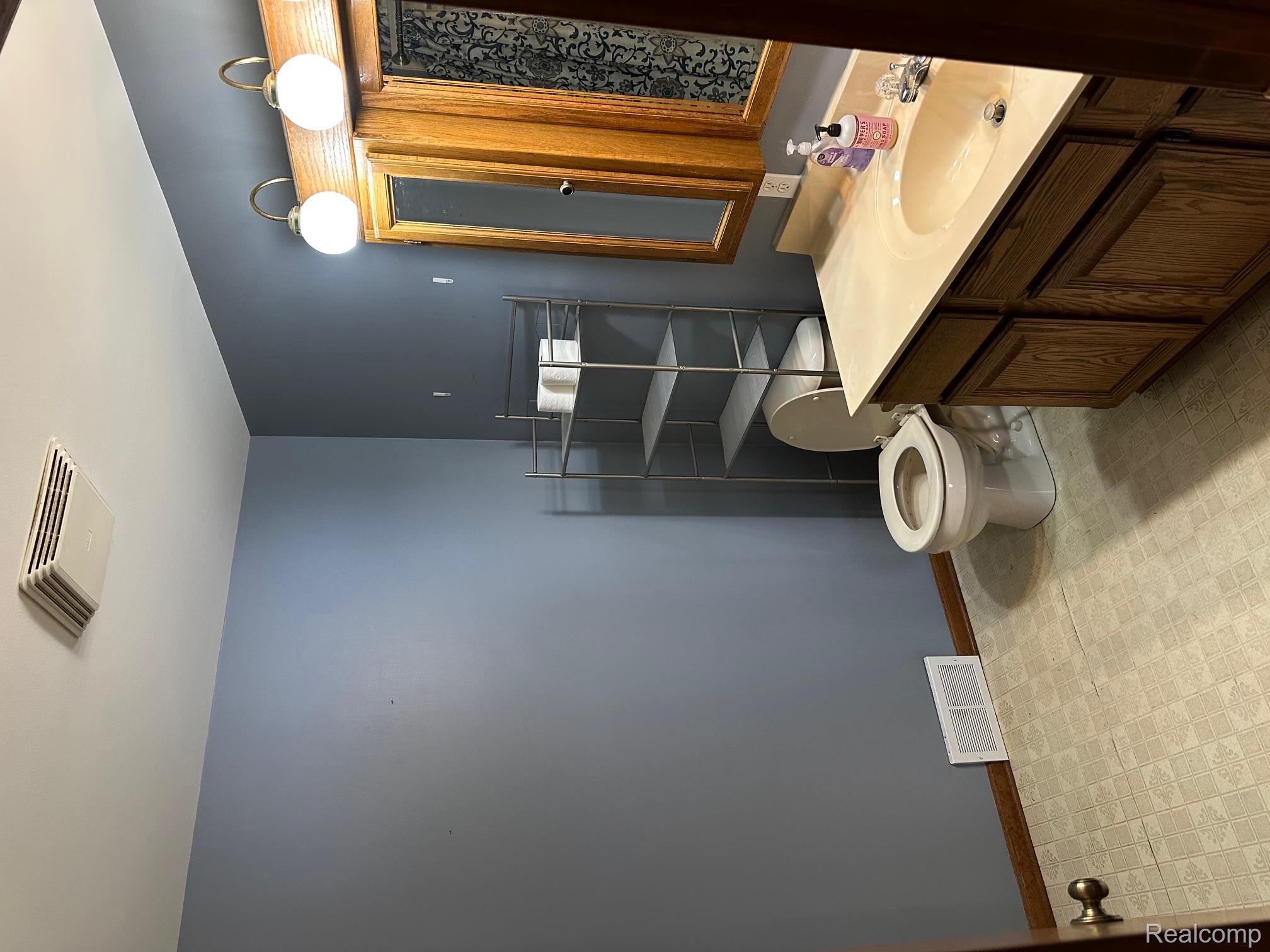3803 Warner Road Cass City, MI 48726 - Photo 70 of 85 Bathroom featuring vanity and light floors