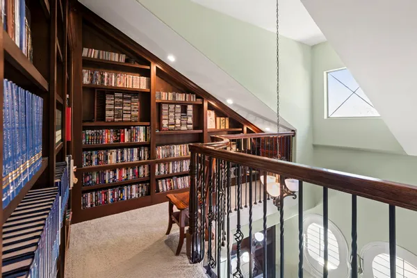 a view of room with hardwood floor and ceiling fan