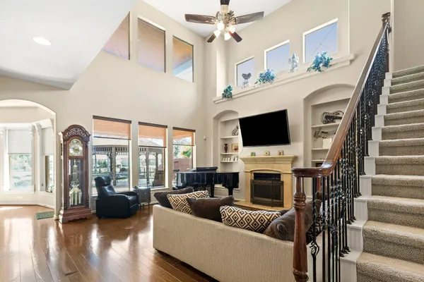 a living room with furniture fireplace and a flat screen tv