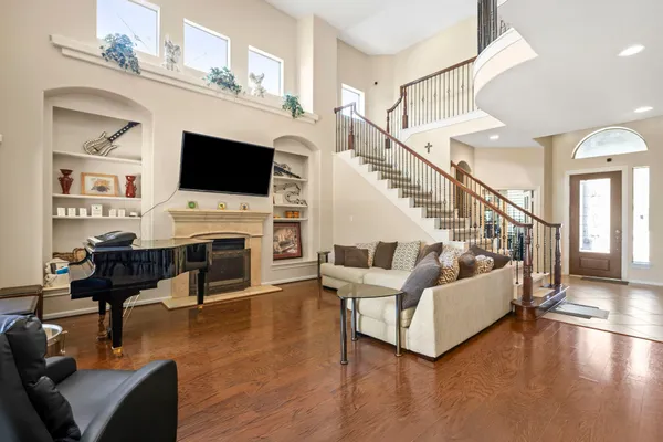 a living room with furniture and a flat screen tv