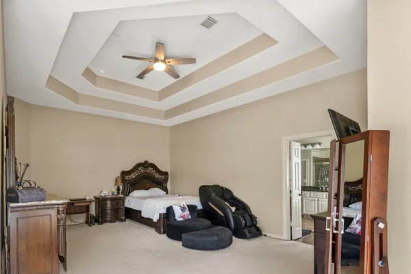 a room with gym equipment and a chandelier