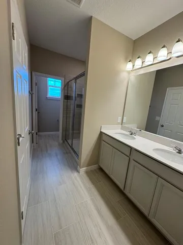 a room with a mirror and a sink